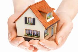 Hands holding house
